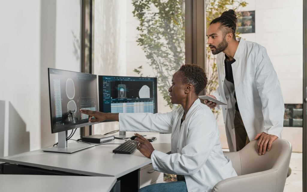 Clinicians reviewing imaging results on screen